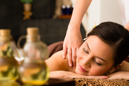 Chinese Asian woman in wellness beauty spa having aroma therapy massage with essential oil, looking relaxed